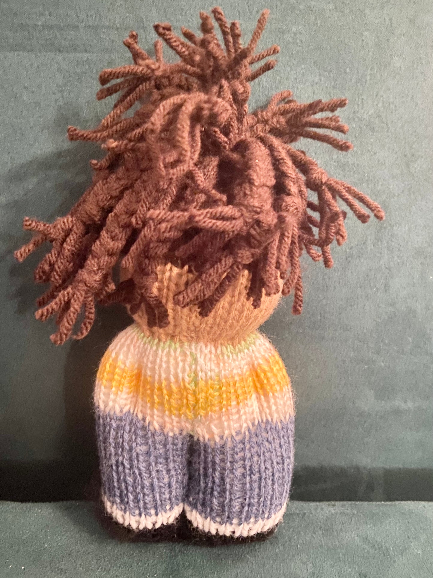 Black knit doll with Locs in top knit with yellow & white sweater + blue pants and shoes
