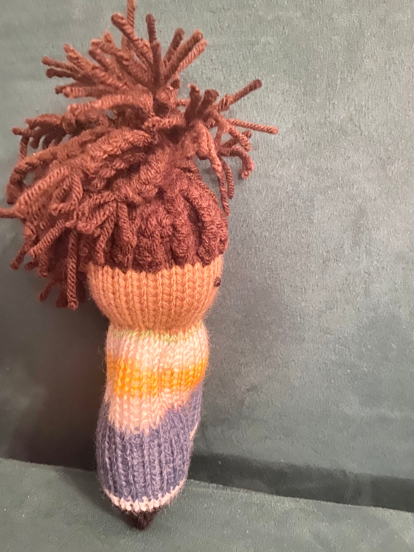 Black knit doll with Locs in top knit with yellow & white sweater + blue pants and shoes