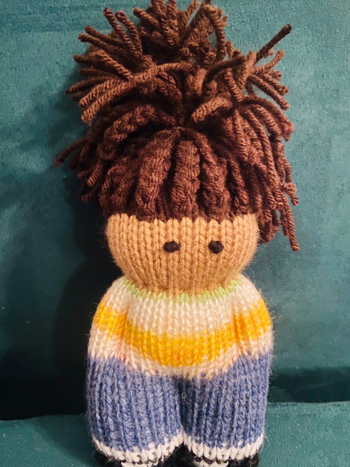 Black knit doll with Locs in top knit with yellow & white sweater + blue pants and shoes